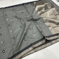 Silver grey Chanderi saree showing black and silver geometric buttas
