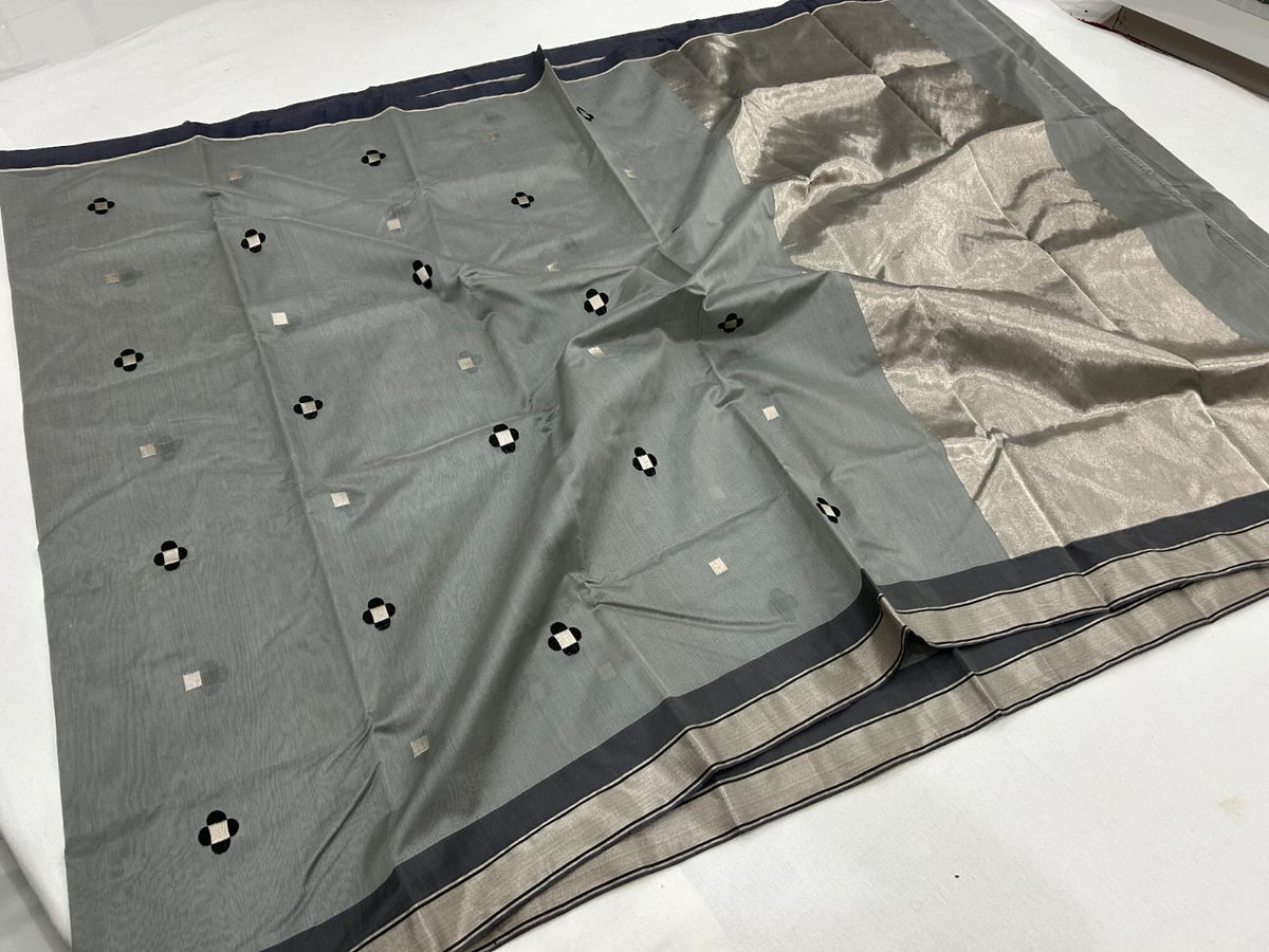 Silver grey Chanderi saree showing black and silver geometric buttas