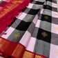 Pure Kanchipuram Silk Saree laid out with bold checked body, gold motifs, and red zari woven border, available in the USA