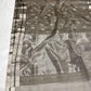 Draped Stone Grey Katan Silk Chanderi showing silver-tone motifs with green centres and silver border with green stripes.