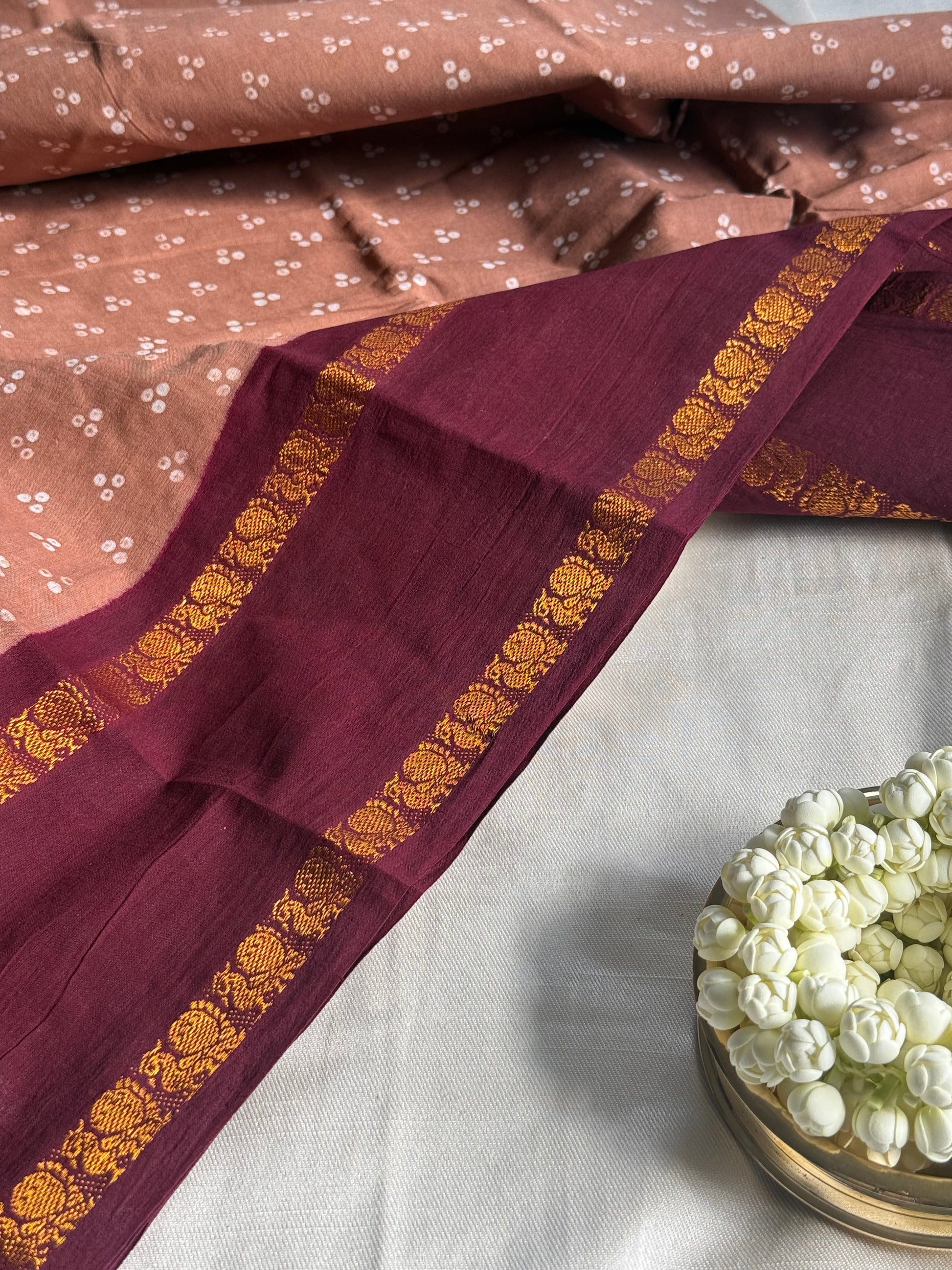 Handcrafted Sungudi cotton saree — tonal border and resist-dyed surface detail