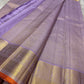Spread lavender pure Kanchipuram silk saree with gold zari border and orange selvedge, shown available in the USA.