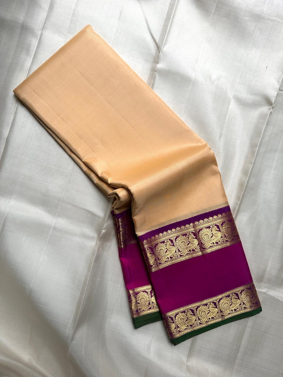 Handloom Kanchipuram saree pink border closeup — warm ivory beige Kanchipattu silk — Idam Living