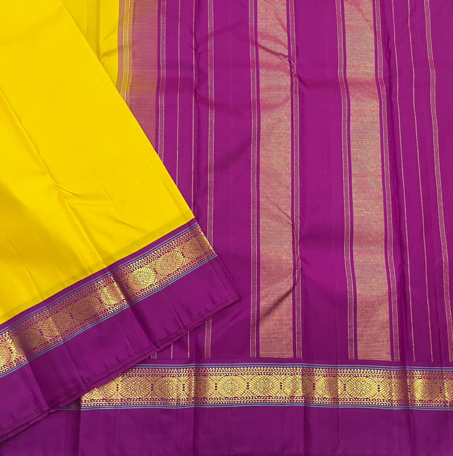 Full spread pure Kanchipuram silk saree with yellow body and purple striped pallu, available in the USA