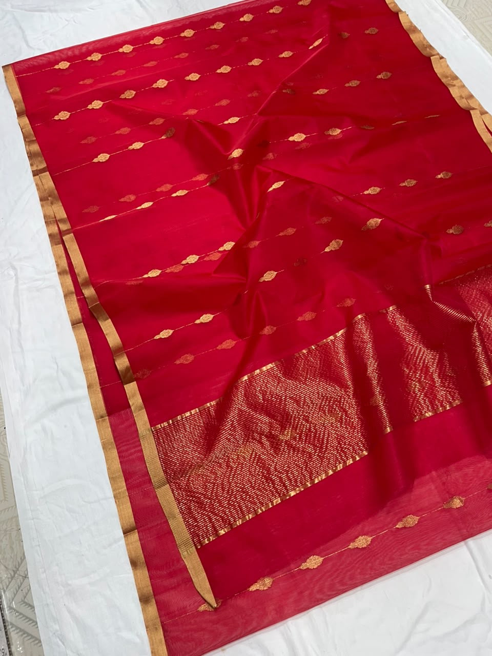 Red Chanderi saree showing gold-toned leaf motifs