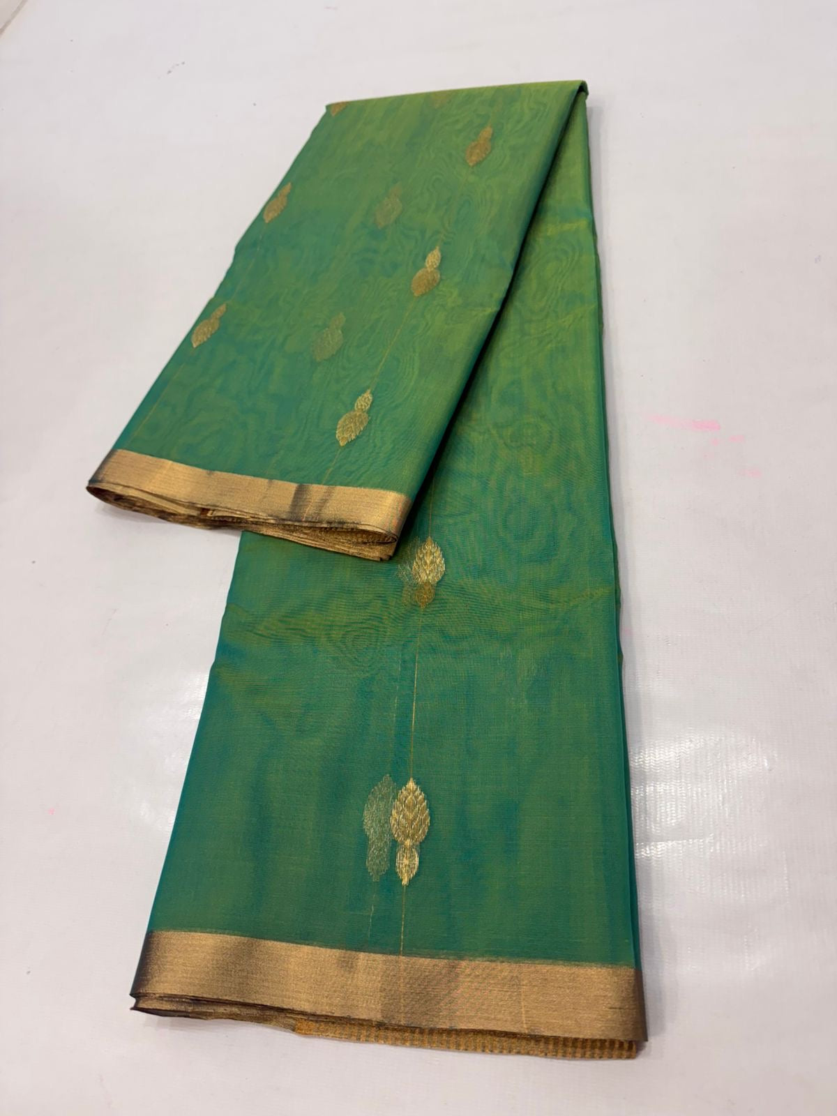 Sea Green handloom Chanderi Katan Silk saree draped, showing the fabric's natural translucence