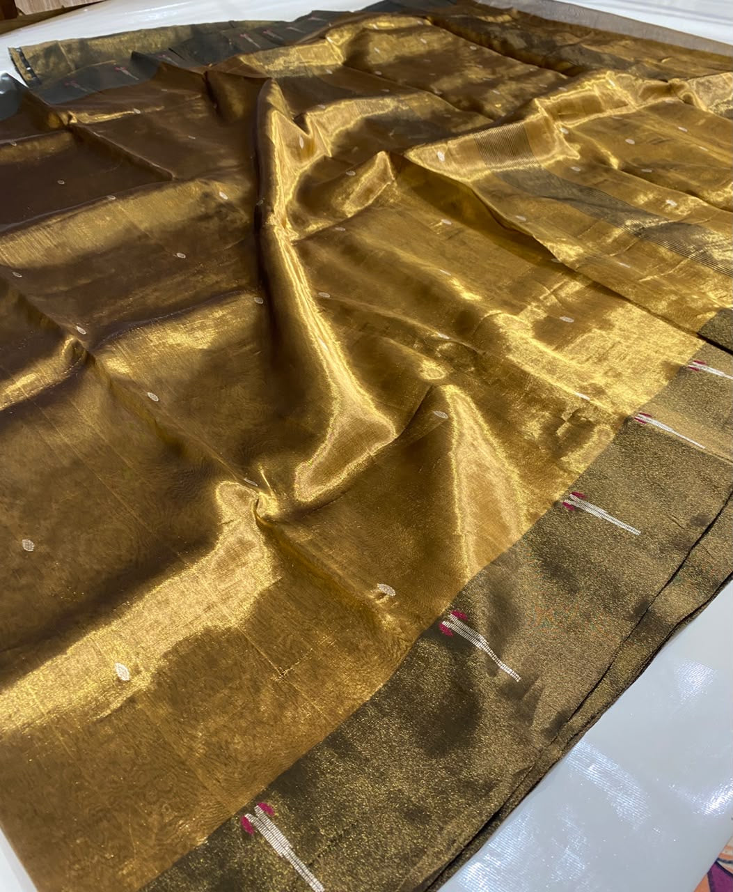 Antique Gold handloom Tissue Silk Chanderi saree body detail with spaced metallic buttas on a sheer luminous ground