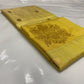 Turmeric Gold handloom Tissue Pattu Silk Chanderi saree body detail with fine linear checks and petite gold woven buttas