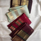 Aubergine Kanjivaram silk saree folded, showing border and pallu