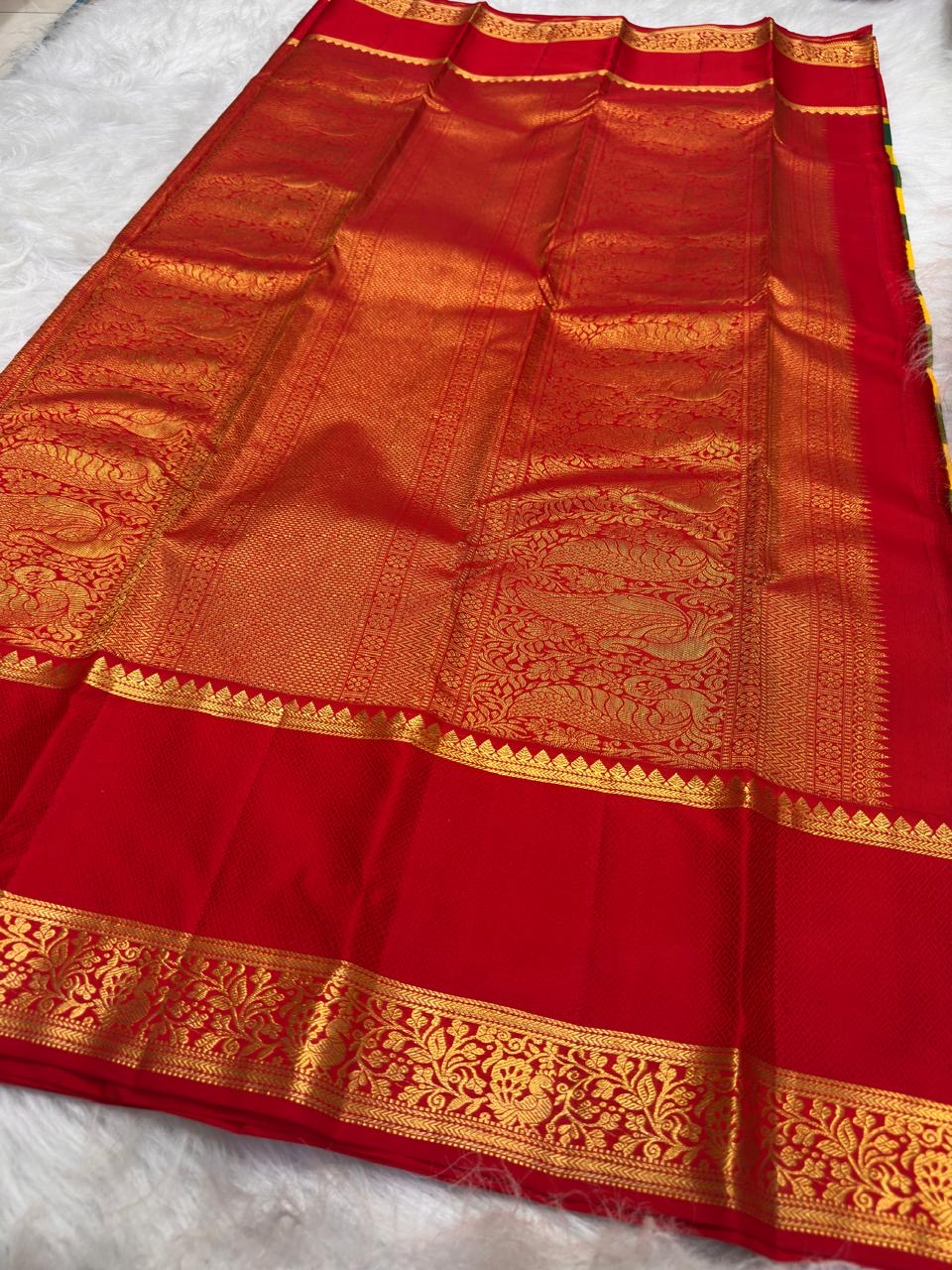 Black, Grey and Ivory pure silk KanchiPattu saree, Kanchi Kattam weave with Pillar-Box Red border — folded view