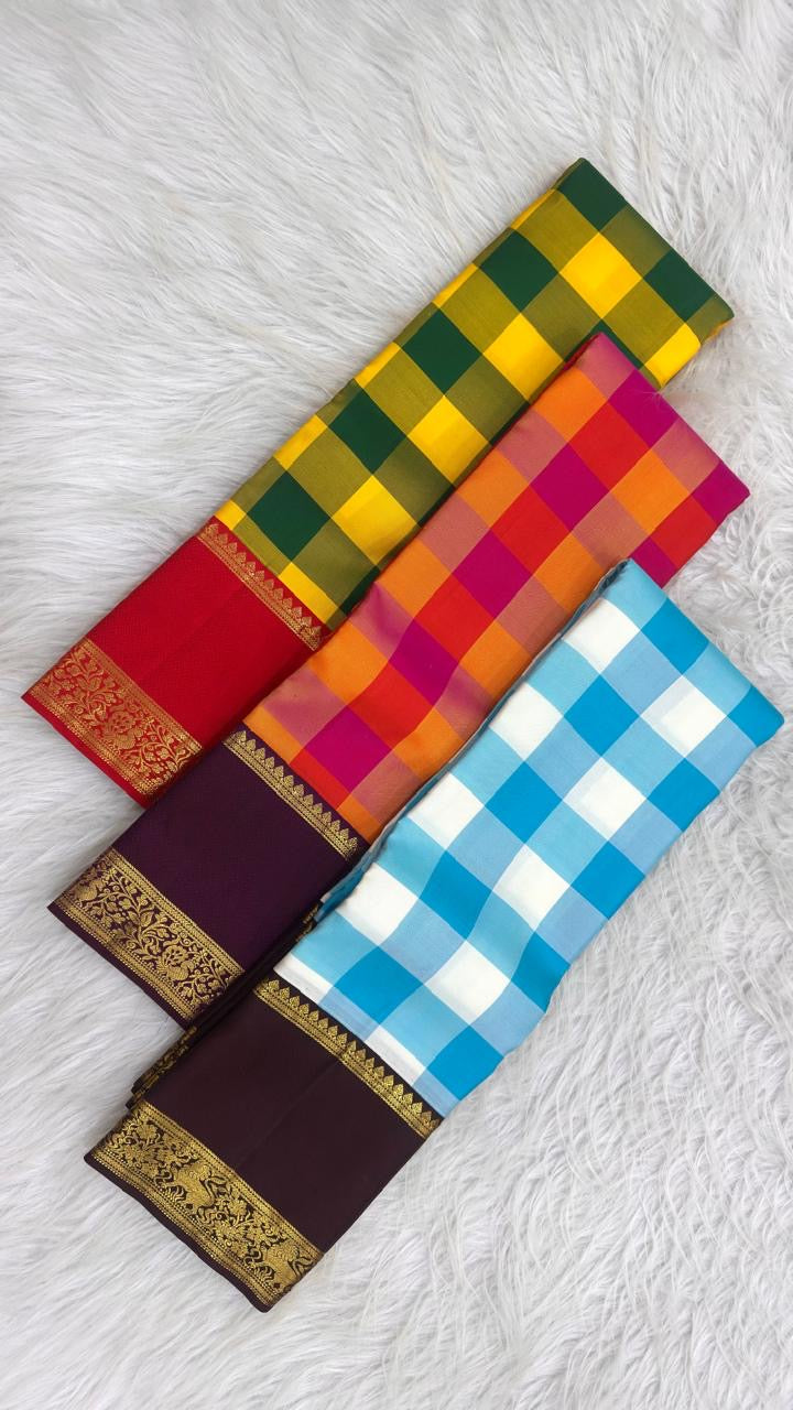 Handwoven sky blue and ivory Kanchipuram saree with a gold-zari peacock border.