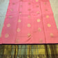 Handwoven blush pink Kanchi Pattu Korvai silk saree, mayil buttas detail