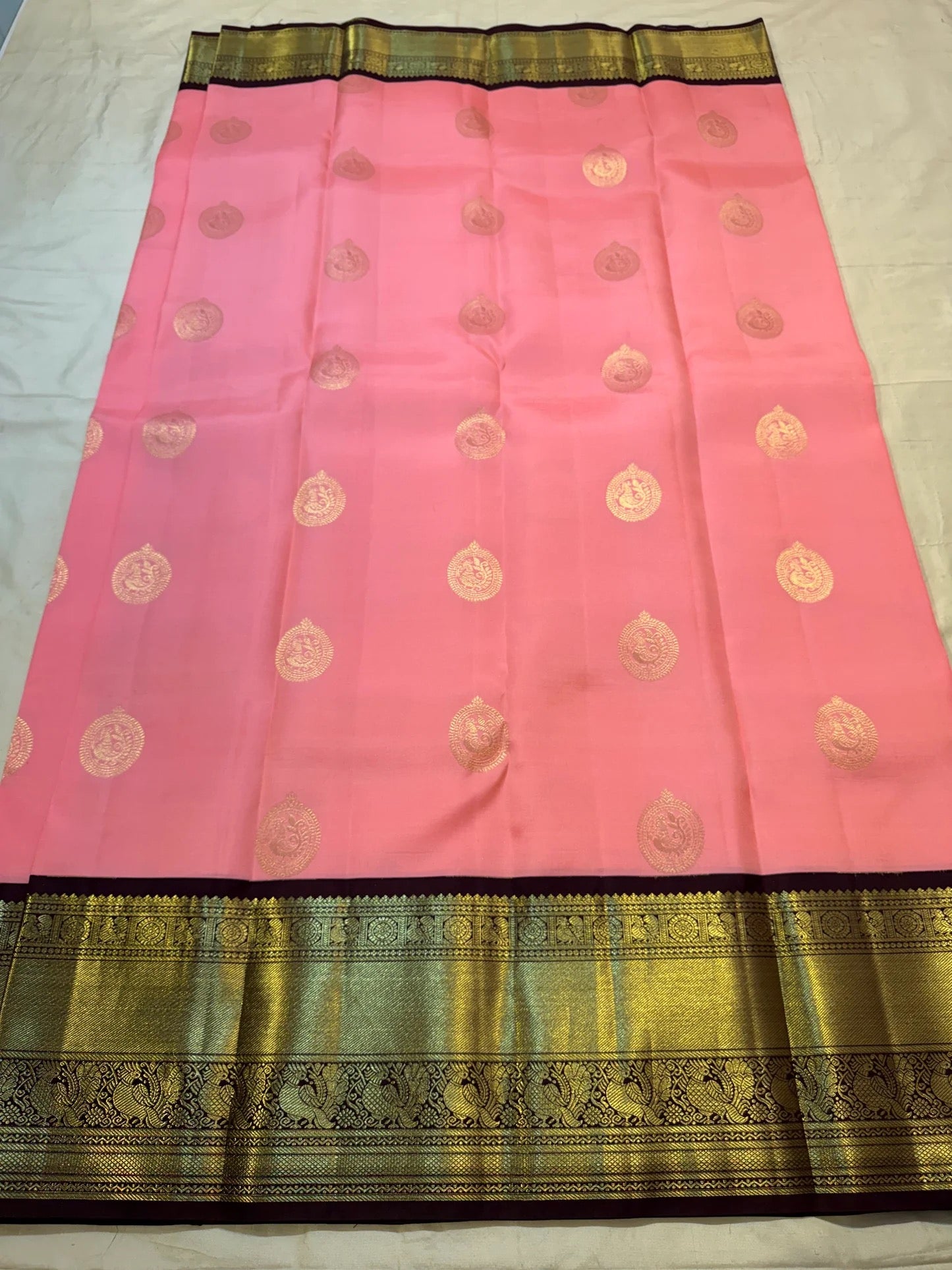 Handwoven blush pink Kanchi Pattu Korvai silk saree, mayil buttas detail