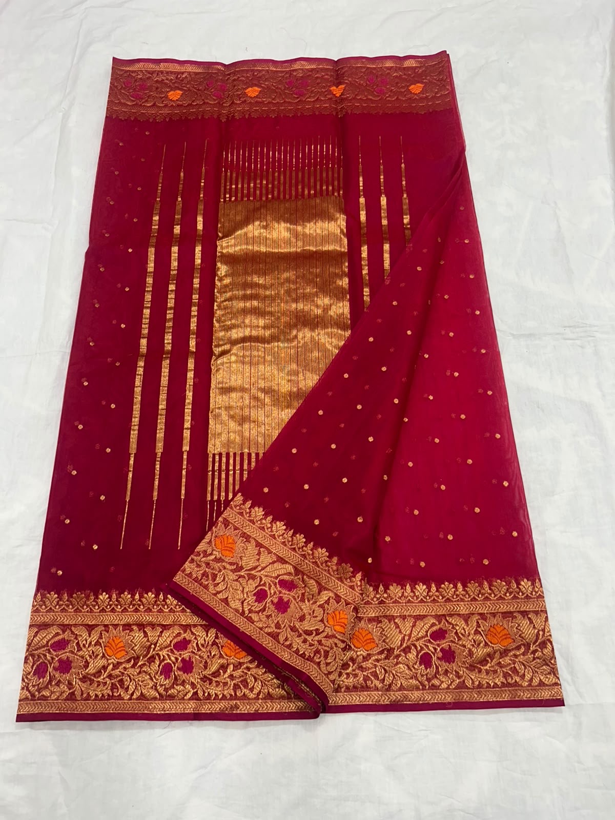 Handwoven Chanderi saree showing pink body and metallic pallu