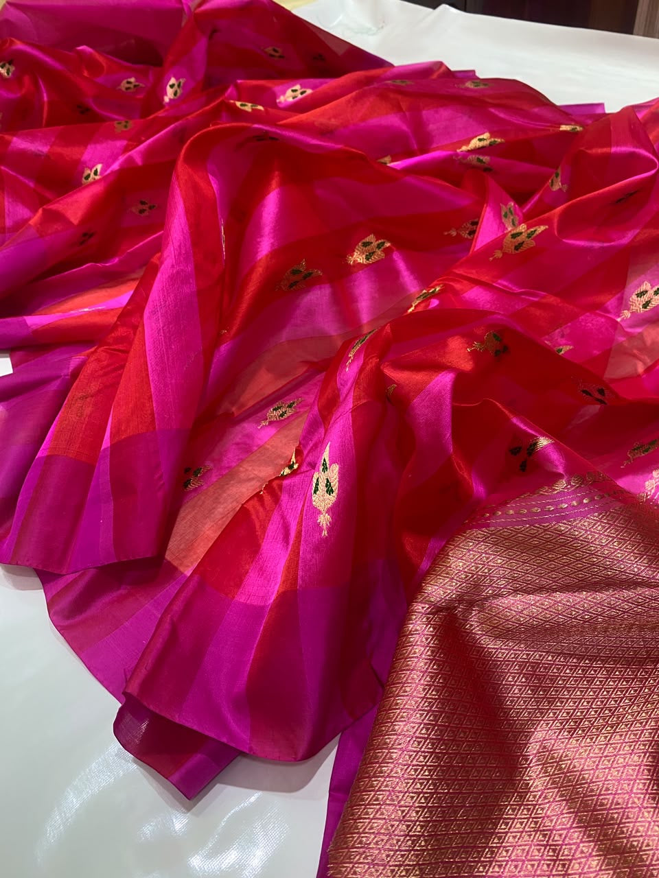 Handwoven Chanderi saree showing Rani pink tonal stripes