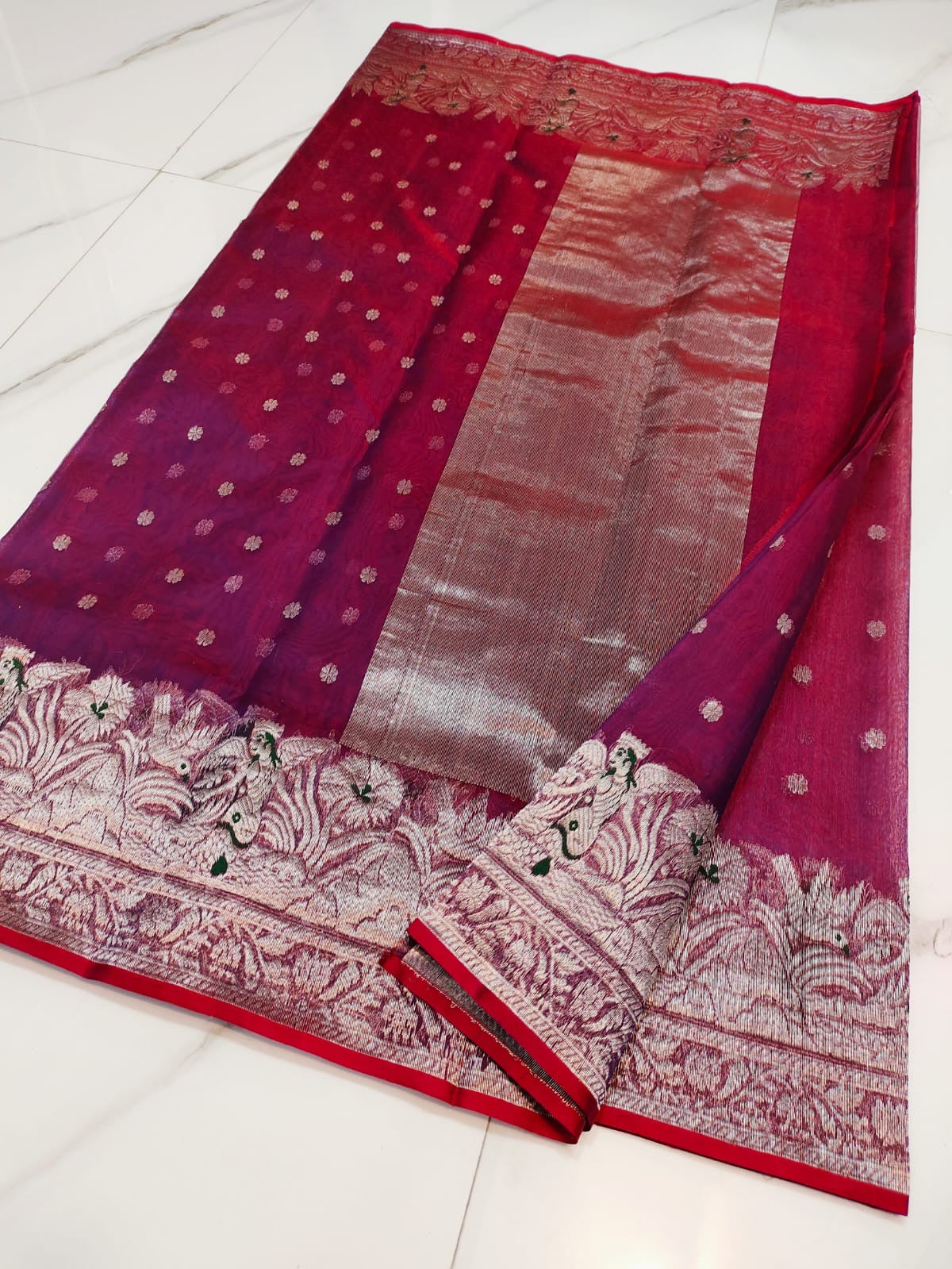 Full-length drape of a berry red Chanderi Katan Silk saree with ornate silver-rose floral border