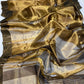Close view of sheer Antique Gold Tissue Silk Chanderi with spaced buttas and olive border motifs with pink accents