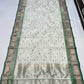 Warm ivory Chanderi saree with dotted emerald and silver butis