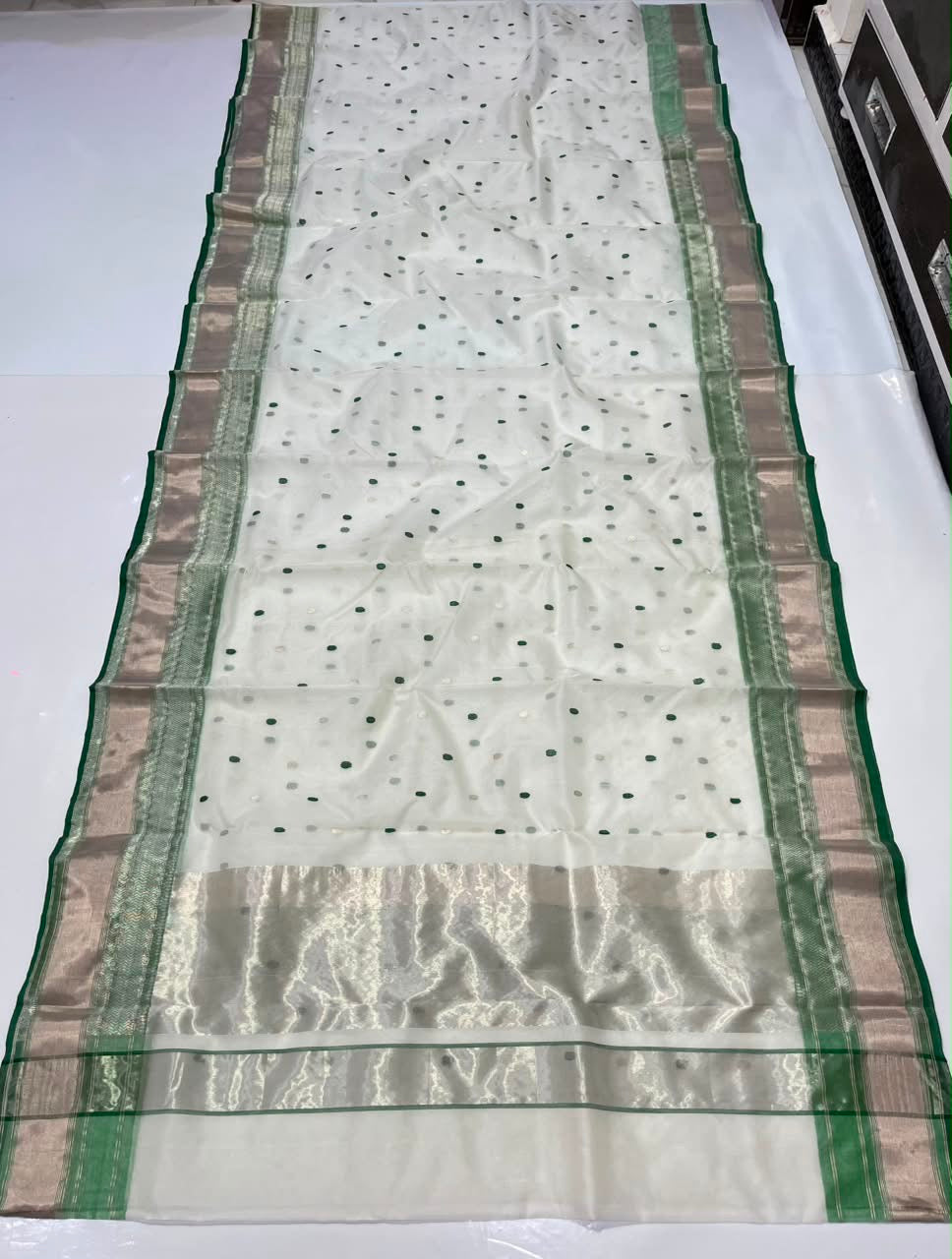 Warm ivory Chanderi saree with dotted emerald and silver butis