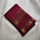 Close-up of gold zari buttas on Deep Raspberry Red Kanchi Pattu silk saree body