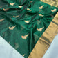 Festive emerald green Chanderi handloom saree with refined zari work and graceful silk texture
