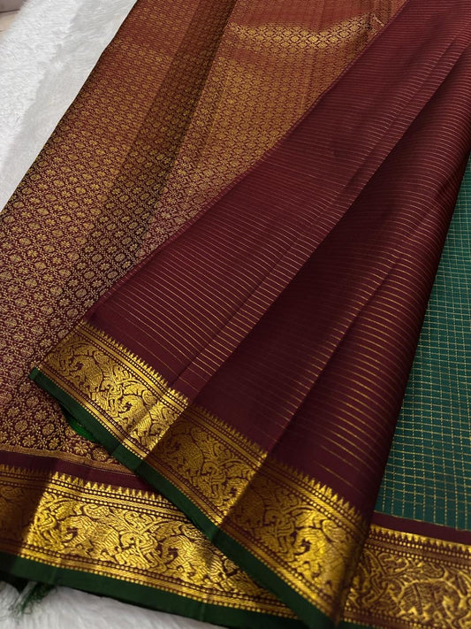 Deep green Kanjivaram silk saree with traditional antique gold grid detailing