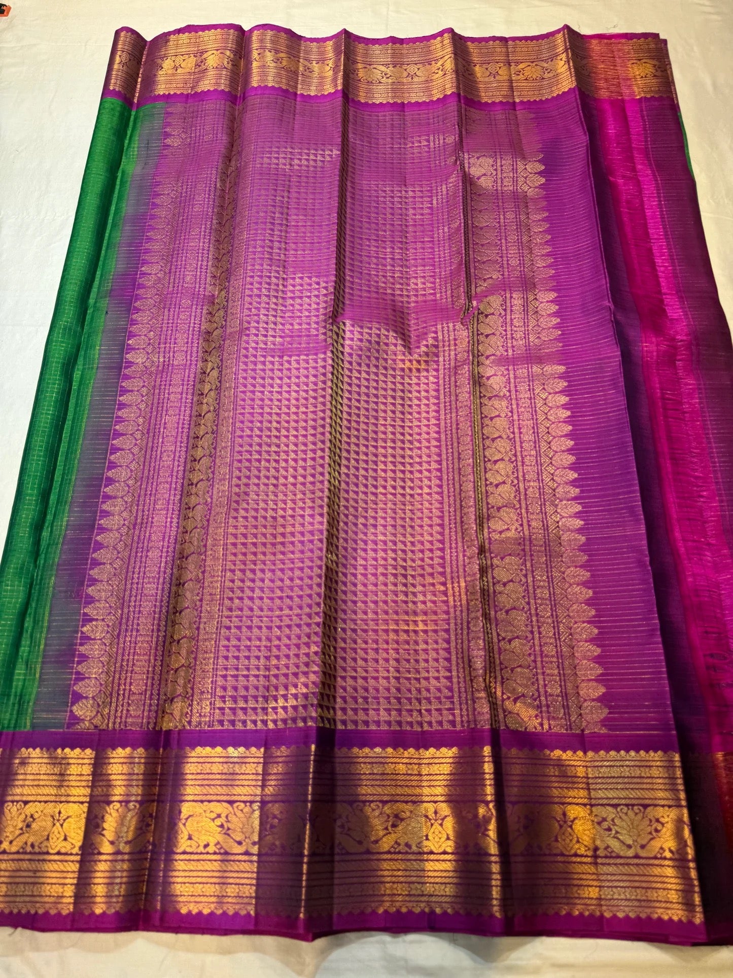 Folded view of forest green and magenta zari kattam KanchiPattu silk saree — Idam Living