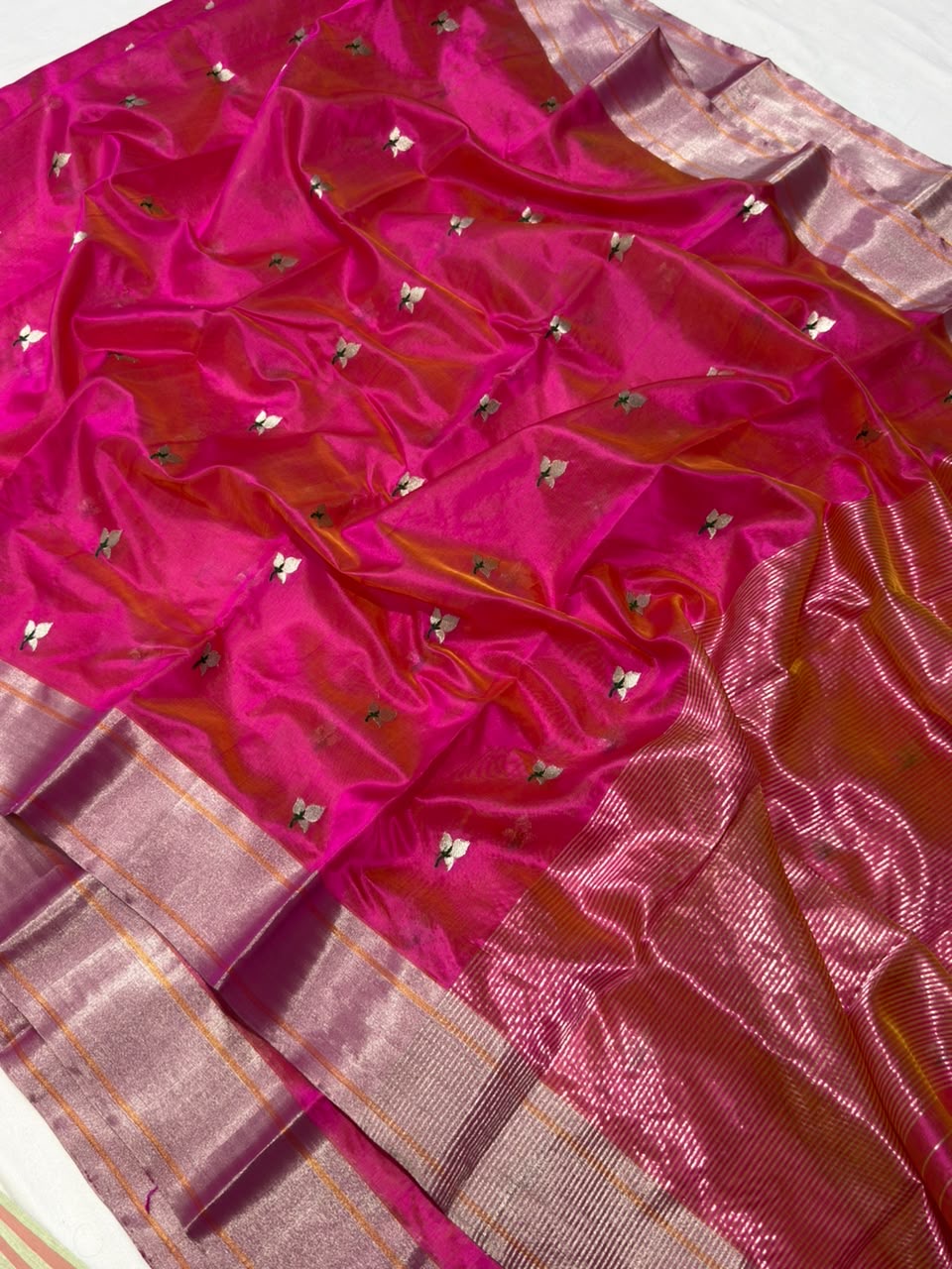 Handwoven fuchsia pink Chanderi saree, silver-gold zari border detail