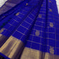 Grand antique gold zari pallu on Royal Blue Zari Kattam Kanchipuram saree with densely woven geometric ornamental detailing.