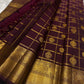 Deep Aubergine Gandaberunda Zari Kattam Kanjivaram saree styled to show the woven pallu and border.