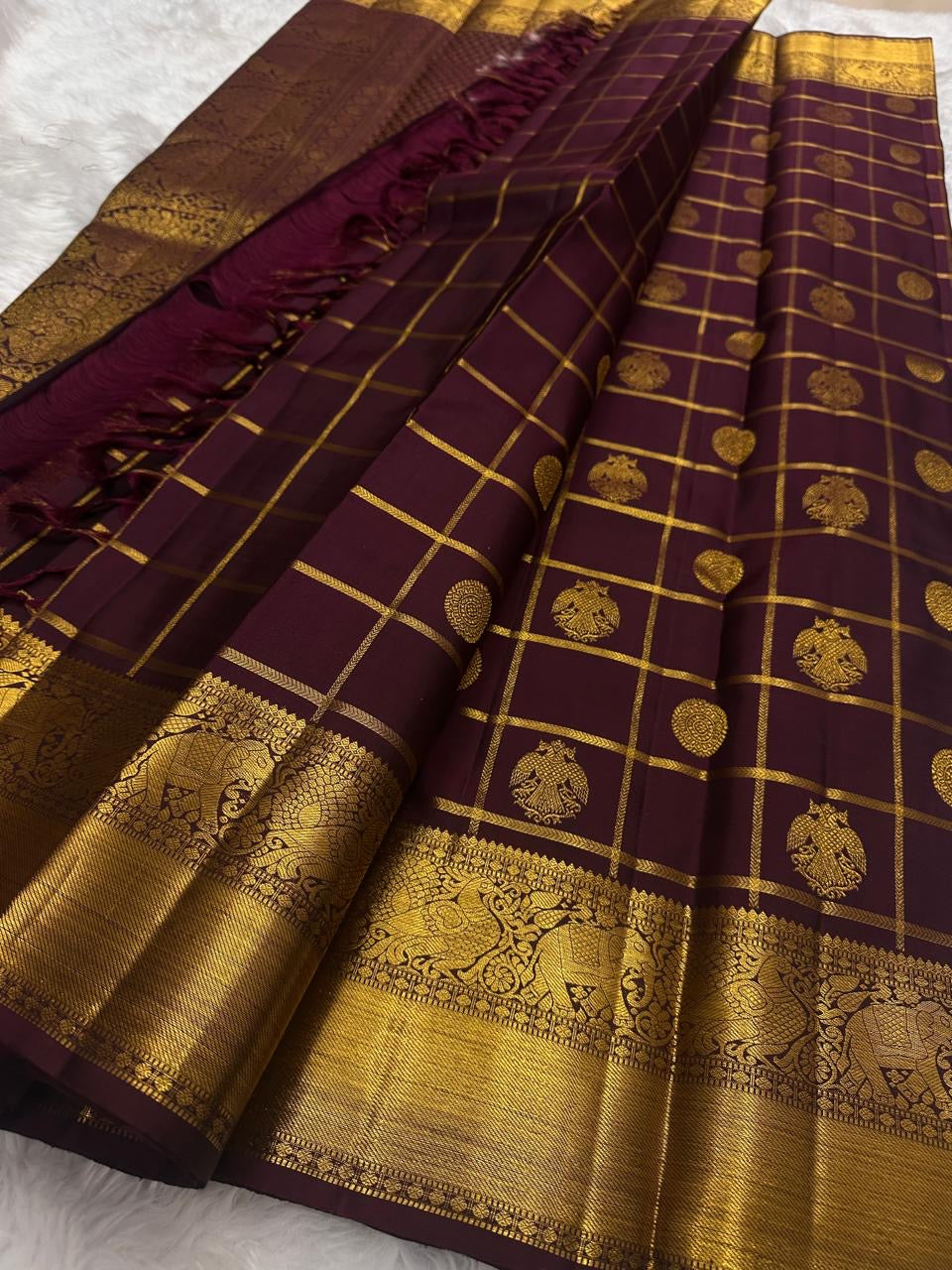Deep Aubergine Gandaberunda Zari Kattam Kanjivaram saree styled to show the woven pallu and border.