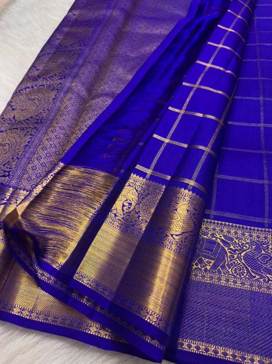 Grand antique gold zari pallu of Deep Violet Zari Kattam Kanchipuram saree with geometric weaving and ornate floral registers.