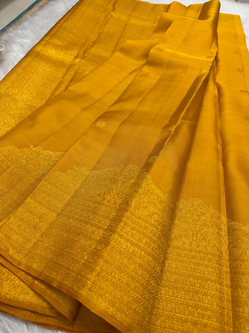 Handwoven golden turmeric Kancheepuram saree — full saree overview
