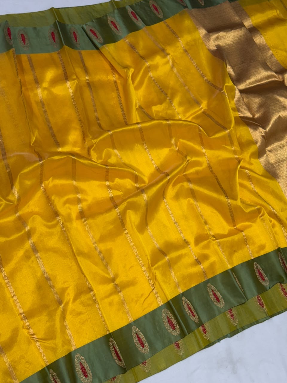Marigold yellow handloom saree with gold-toned woven stripes