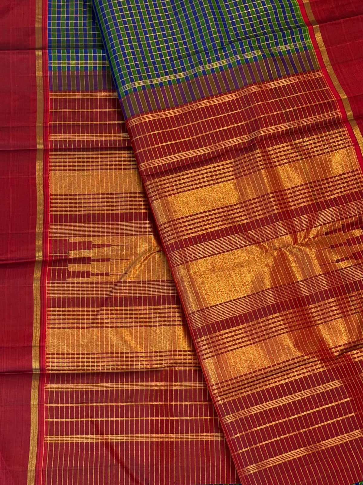Green and cobalt blue handwoven Pure Silk Kanjivaram Kanchi Kattam saree with gold grid lines and red Rettapet border, full saree view