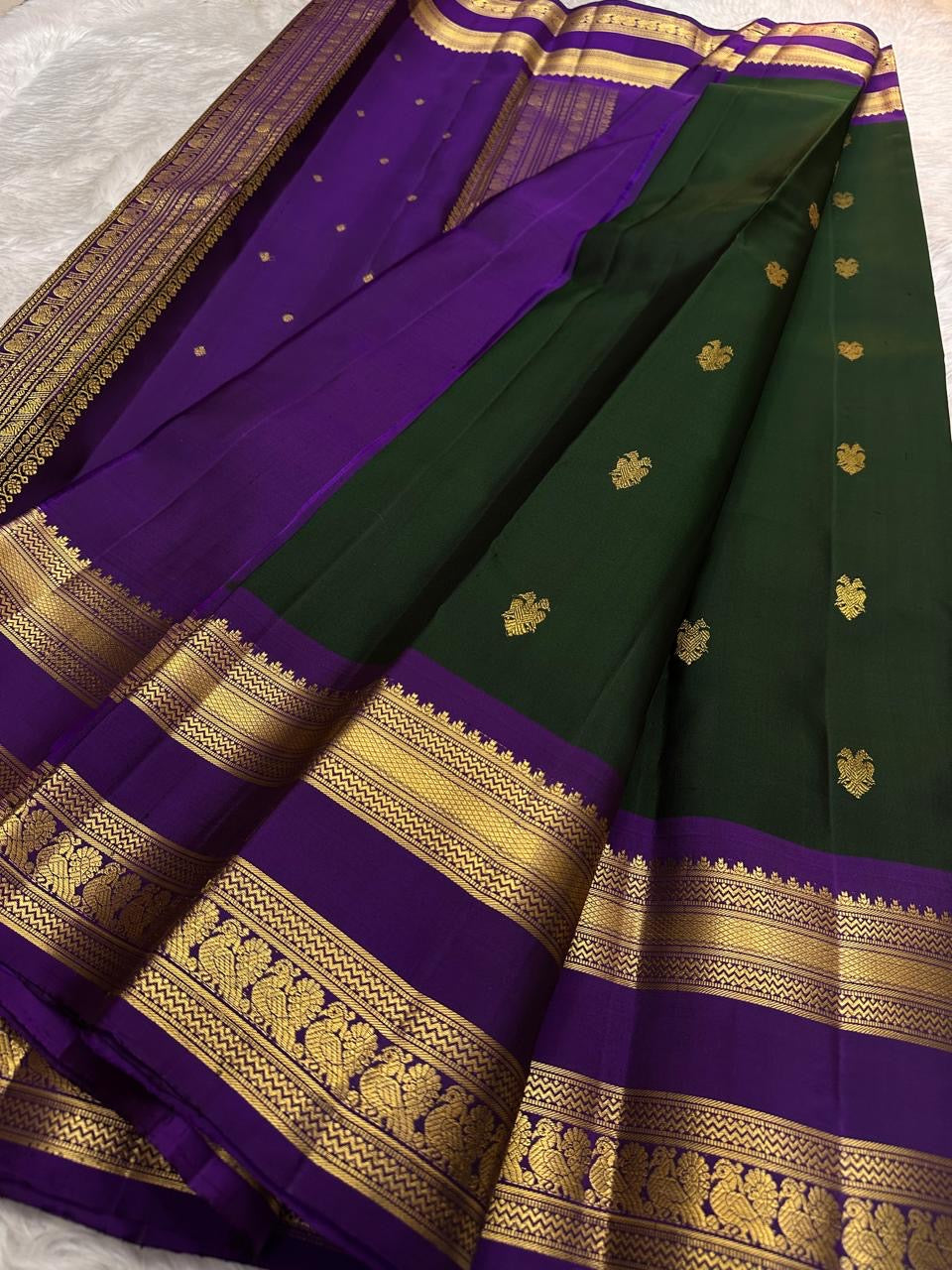Handwoven green Kanchipattu silk saree with royal violet rettapet border Idam Living