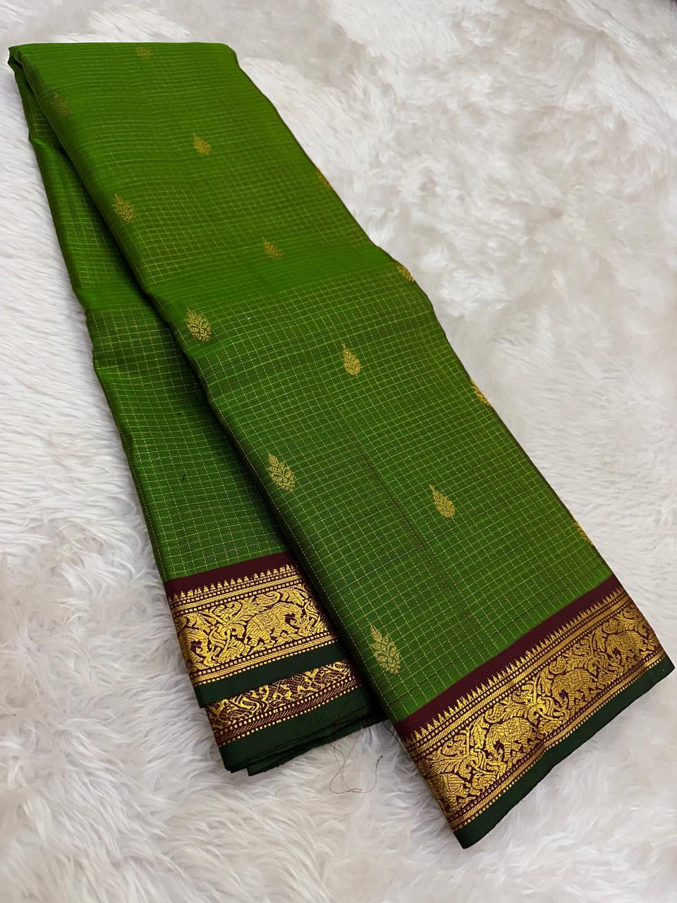 Pure silk Kancheepuram saree in emerald green with maroon zari border