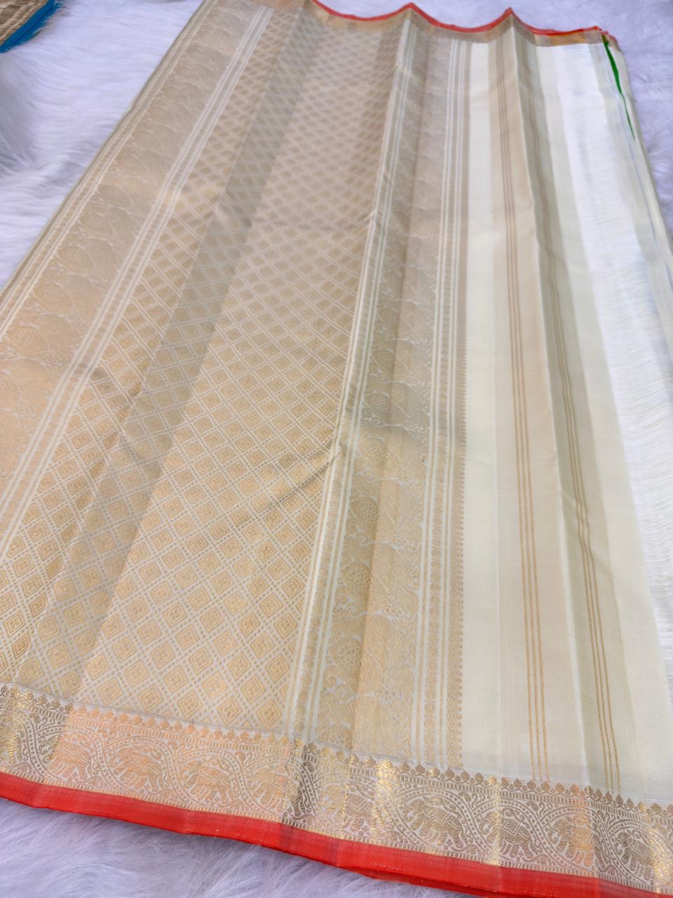 Ivory Handwoven Pure Silk Kanjivaram Saree with Small Gold Buttas & Petite Zari Elephant Border