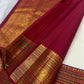 Close view of petite gold maanga buttas on ivory Kanchipuram silk.