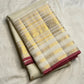 Broad gold zari border detail on ivory pure silk Kanchipuram saree
