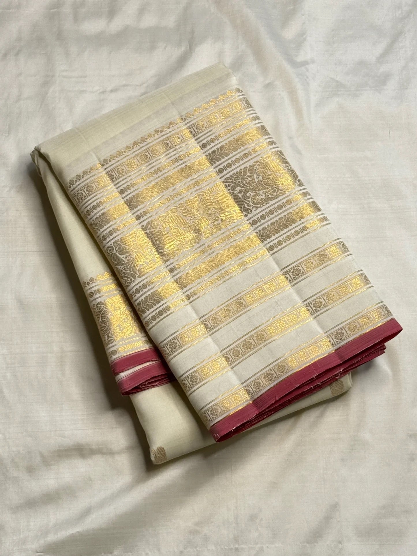 Broad gold zari border detail on ivory pure silk Kanchipuram saree