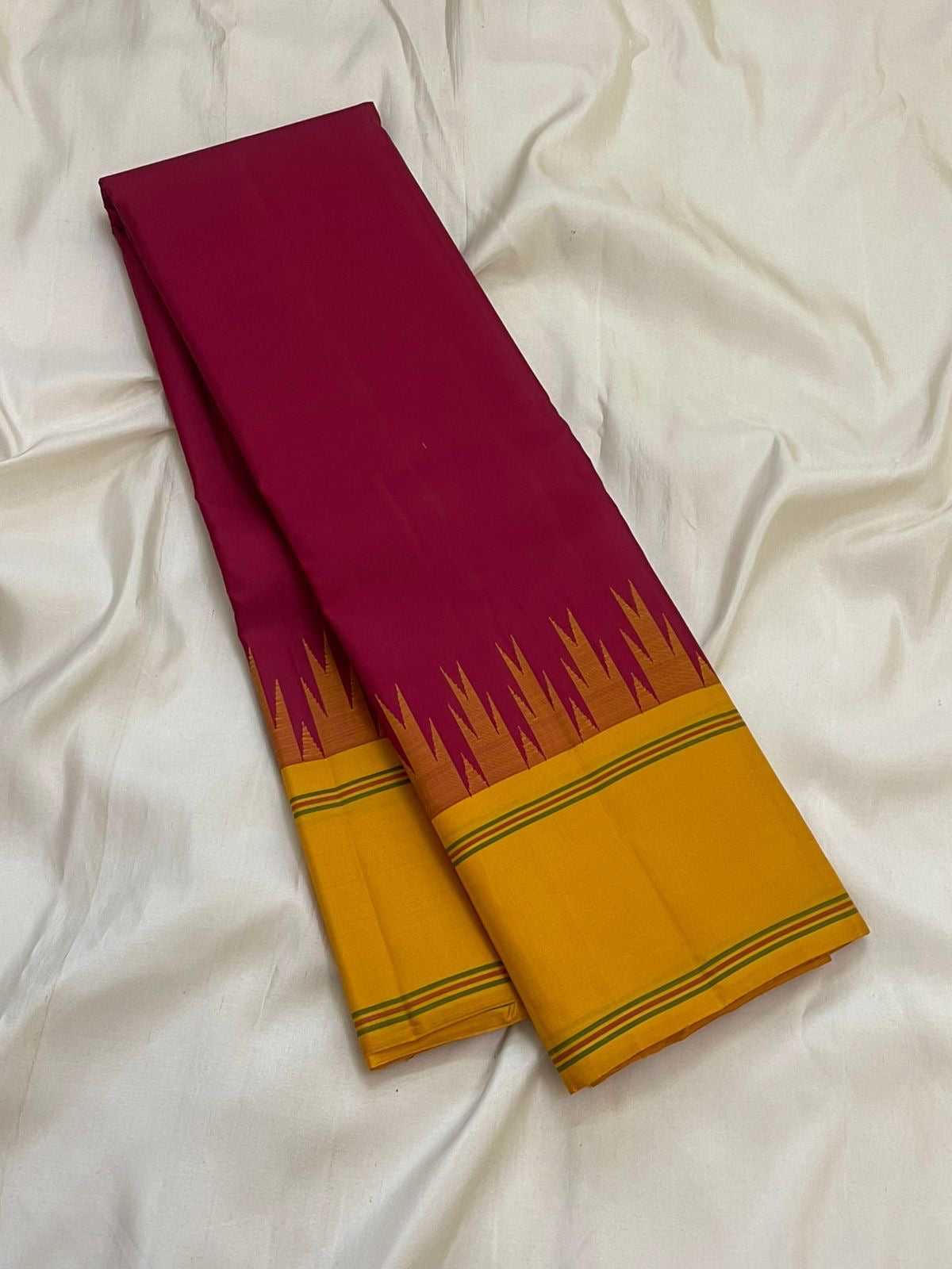 Canary yellow pallu of deep arakku red Kancheepuram pure silk saree with Thazhampoo Reku silk thread cascade