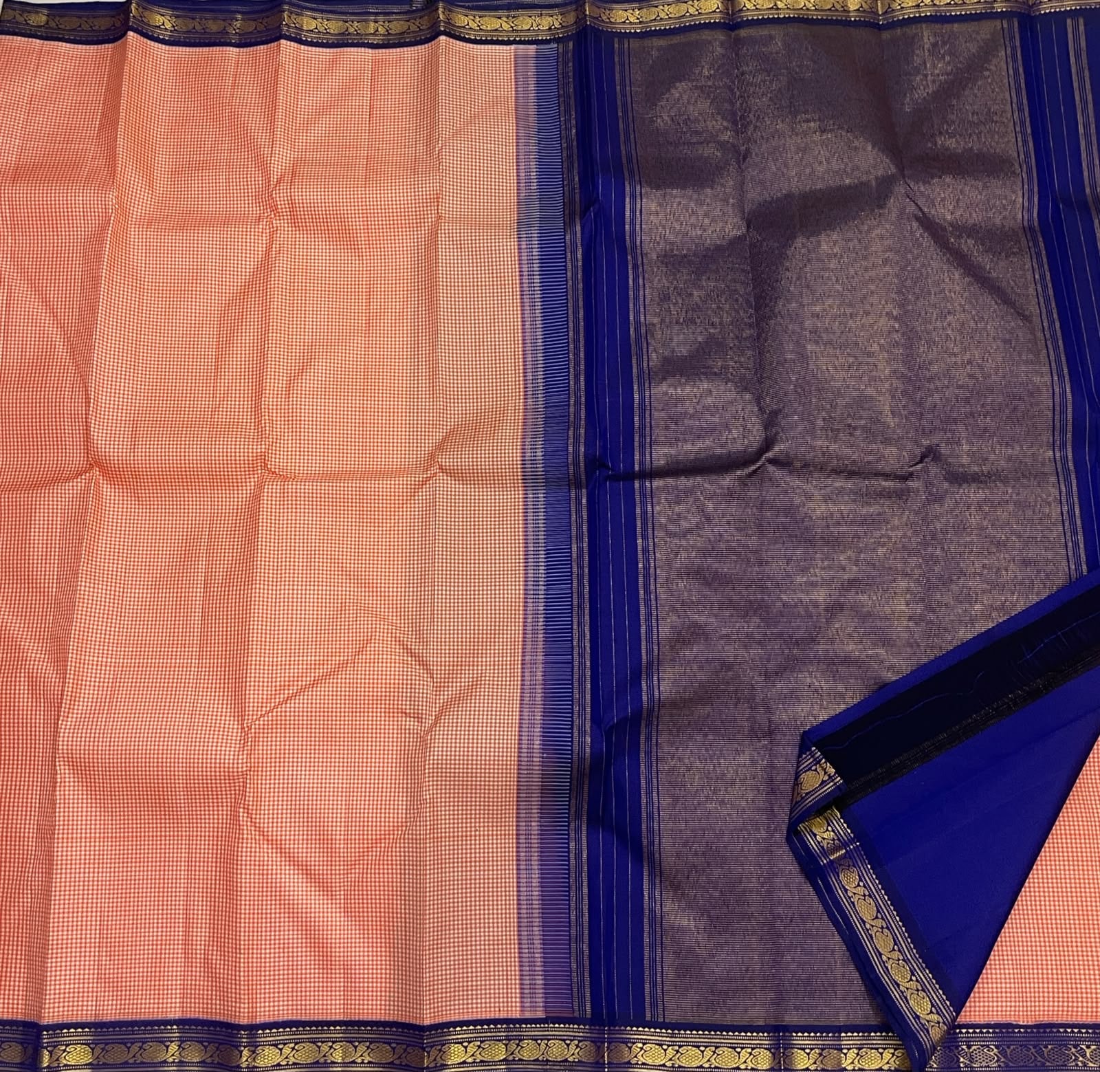 Handwoven Kanchi Kattam saree in soft peach ivory, folded view