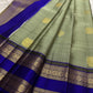 Close-up of Gandaberunda zari motifs on the sage green Kanchipuram Butta saree.