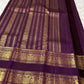 Peacock-plumage Rettapet border with double zari bands on a deep purple handwoven Kanchipuram silk saree