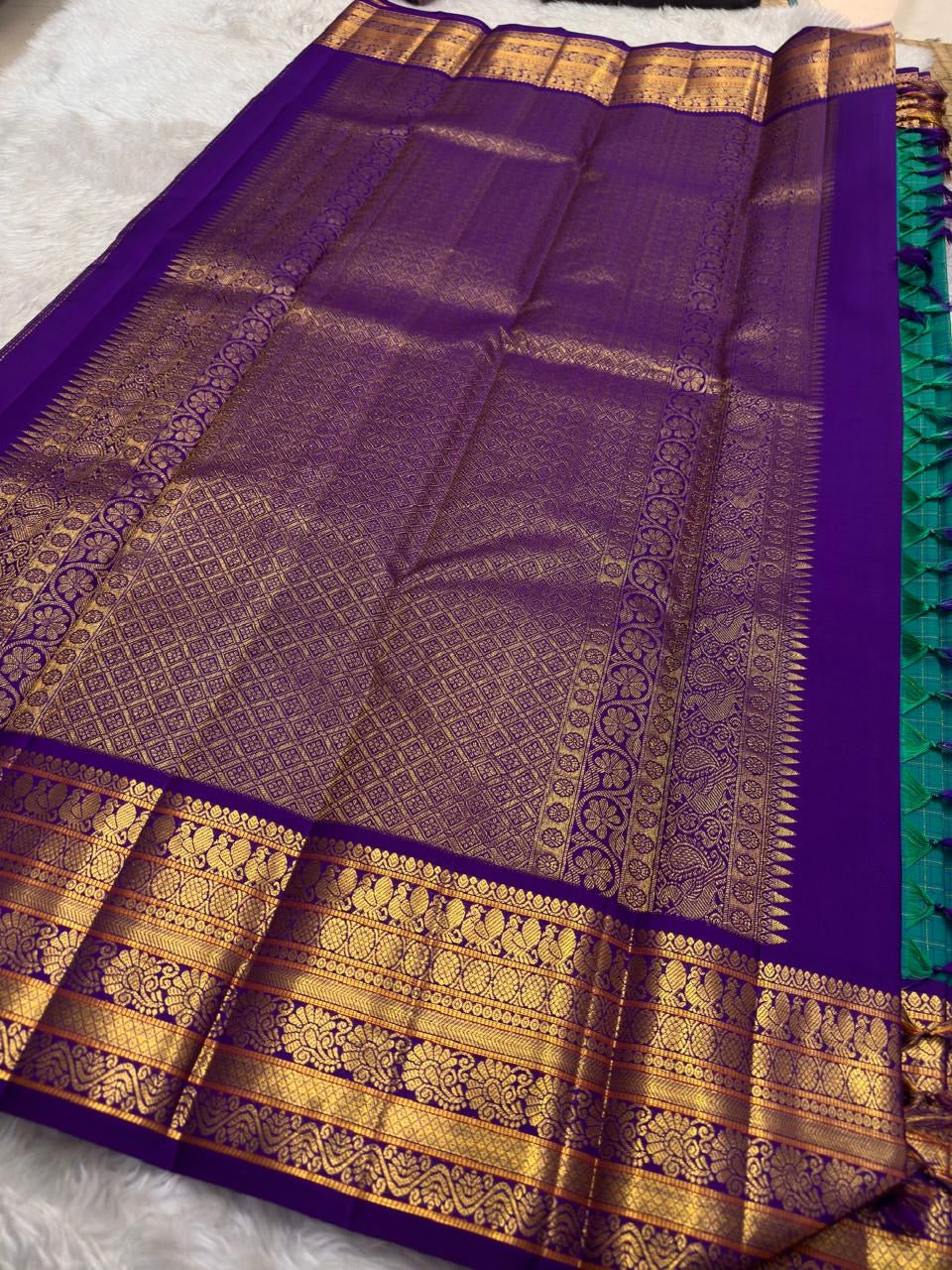 Traditional Kanchipuram Korvai saree in teal blue with separately woven royal purple border