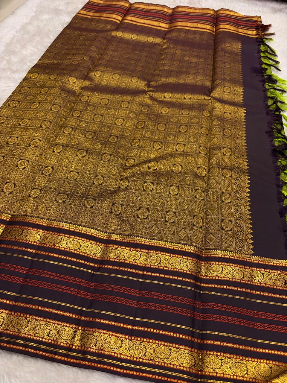 Pure silk Kanchivaram saree with earthy olive green body and dramatic charcoal pallu