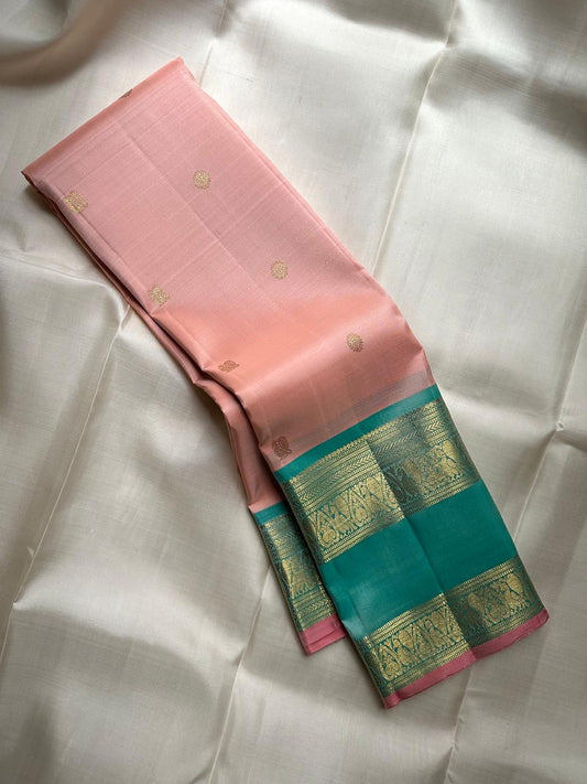 Blush rose Kanjivaram pure silk saree with peacock teal Rettapet border, full drape
