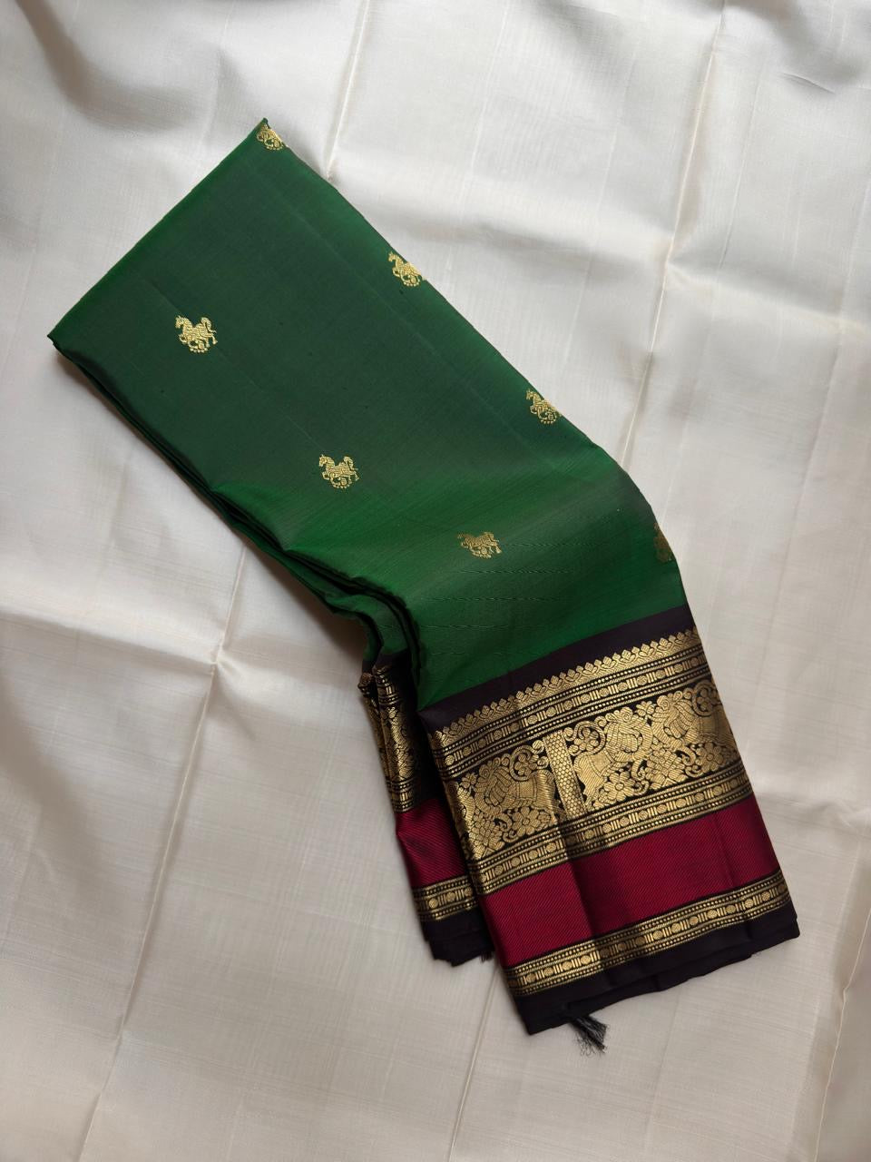 Deep Forest Green pure silk Kanjipuram saree, Butta weave with Deep Aubergine border — full drape view