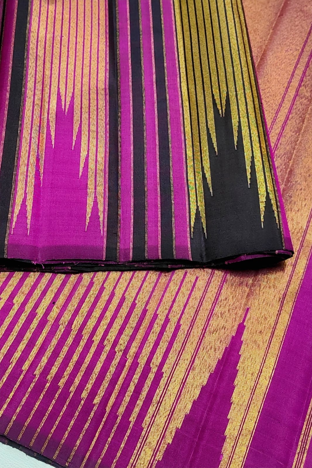 Temple-inspired gold zari border on dark chocolate brown Ettukol Kanjivaram silk saree